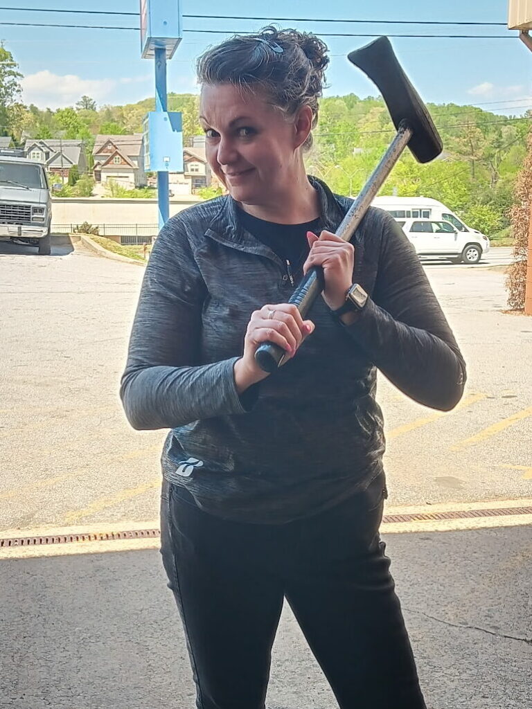 Melody holding a sledgehammer